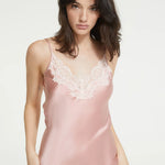 Close up of Detail of lace-trimmed V-neckline and spaghetti straps on Ginia Silk Slip in Bridal Rose.