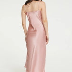 Back view of pink Ginia silk slip, showing mid-calf length and adjustable straps.