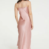 Back view of pink Ginia silk slip, showing mid-calf length and adjustable straps.