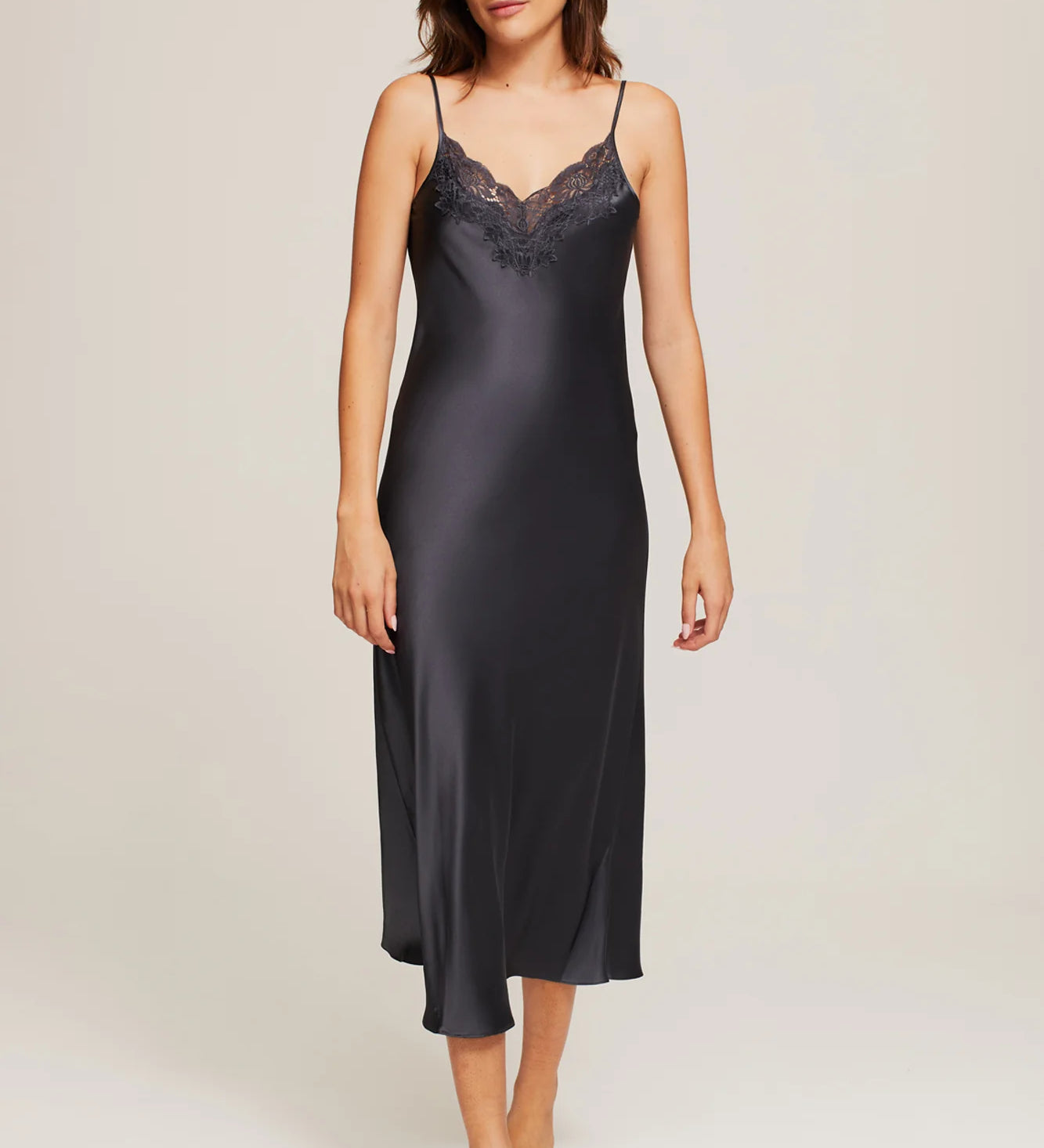 Model wearing Ginia Silk Lace Slip in India Ink, showcasing deep V-neckline and delicate lace trim.