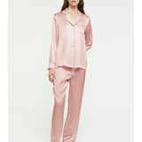 Model wearing Ginia Fine Finishes Silk Pyjama in Bridal Rose, showing collared top and drawstring pants.