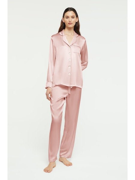 Model wearing Ginia Fine Finishes Silk Pyjama in Bridal Rose, showing collared top and drawstring pants.