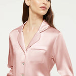 Close-up of Bridal Rose silk pyjama top with Mother of Pearl buttons and piped collar by Ginia.