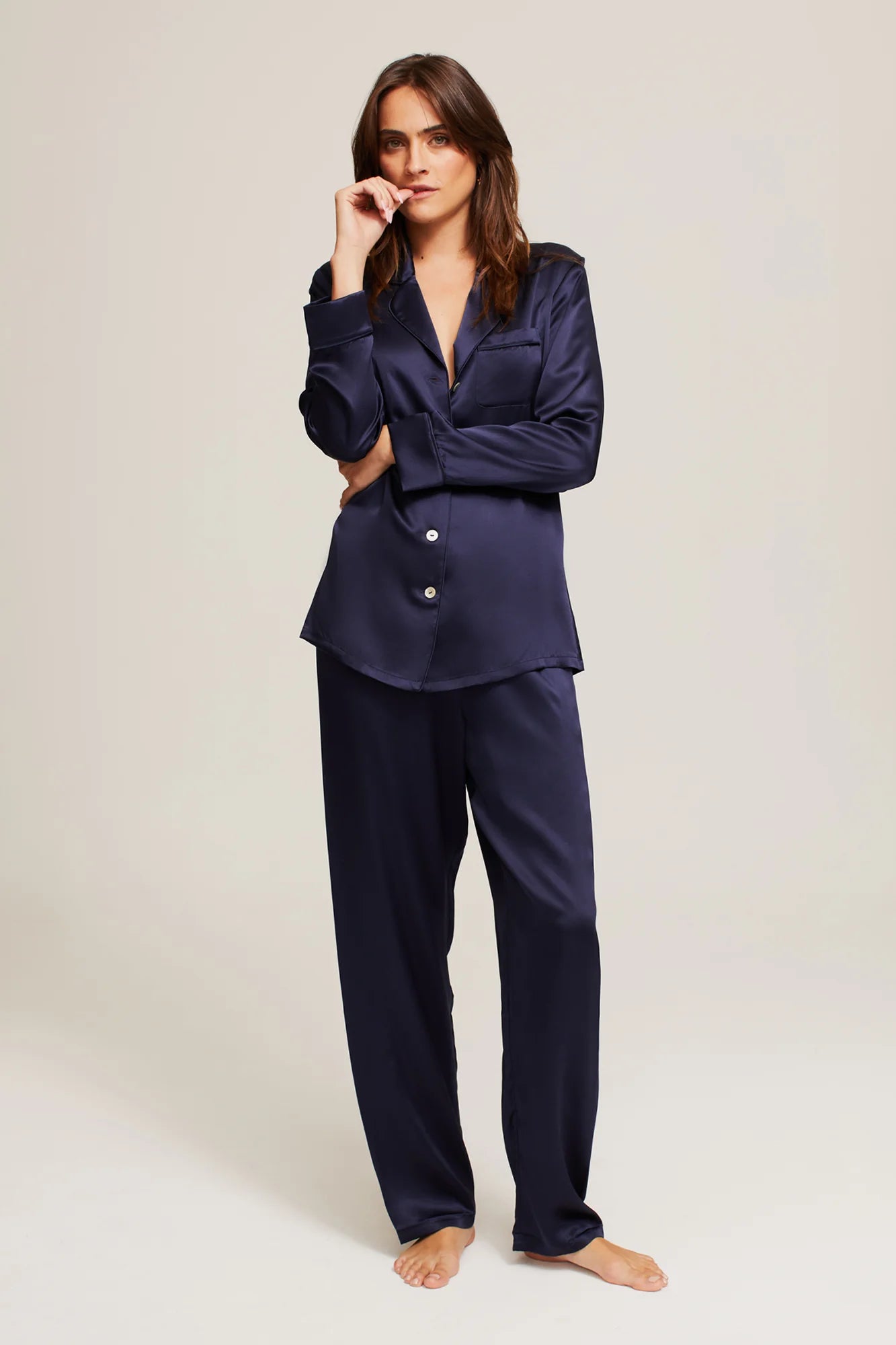 Front view of Ginia Midnight Silk Pyjama set in full view with long sleeves, cuffs and drawstring pants.