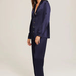Side profile of Ginia Silk Pyjama in Midnight highlighting flowing fabric and tailored fit.