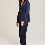 Side profile of Ginia Silk Pyjama in Midnight highlighting flowing fabric and tailored fit.