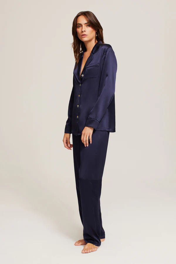 Side profile of Ginia Silk Pyjama in Midnight highlighting flowing fabric and tailored fit.
