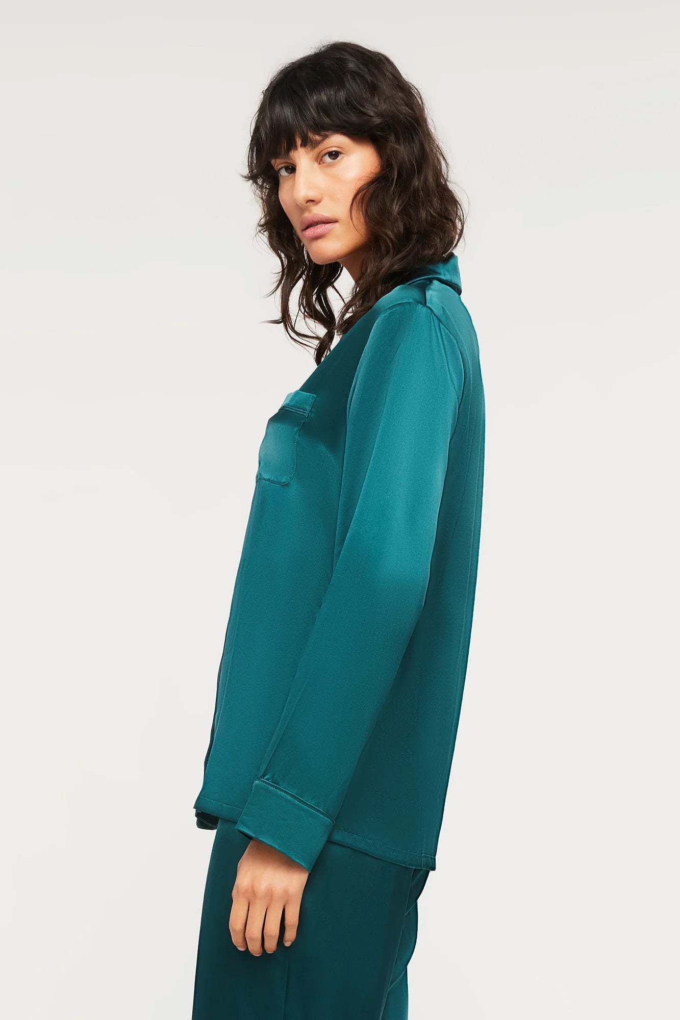 Side view of Ginia Fine Finishes Silk Pyjama in Emerald showing relaxed fit and luxurious sheen.