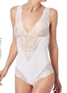 Front view of Model wearing Greta IM Lace Bodysuit in Ivory by Janira, featuring delicate lace detailing and flattering plunge neckline.