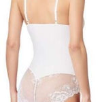 Back view of Janira Greta lace bodysuit in ivory, showing thong-style cut and adjustable shoulder straps.