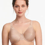 Model in Chantelle Hedona Minimiser Bra Nude, front view showing seamless cups and natural rounded shape, comfort bra from The Foundation.