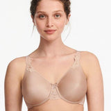 Model in Chantelle Hedona Minimiser Bra Nude, front view showing seamless cups and natural rounded shape, comfort bra from The Foundation.
