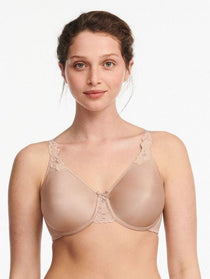 Model in Chantelle Hedona Minimiser Bra Nude, front view showing seamless cups and natural rounded shape, comfort bra from The Foundation.