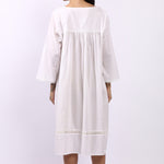 Back view of Lotus Susie 3/4 sleeve white cotton nightdress with lace-trim hemline.