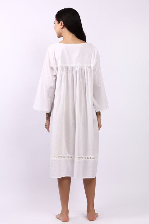 Back view of Lotus Susie 3/4 sleeve white cotton nightdress with lace-trim hemline.