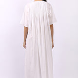 Back view of Lotus Sara short sleeve pintuck nightdress in white cotton fabric.