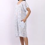 Side profile of white/sky cotton cap sleeve nightdress showing relaxed fit and lace hem detail.
