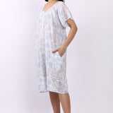 Side profile of white/sky cotton cap sleeve nightdress showing relaxed fit and lace hem detail.