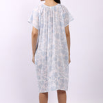 Back of white cotton floral nightdress in sky print with cap sleeves and gathered yoke.