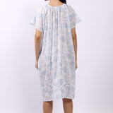 Back of white cotton floral nightdress in sky print with cap sleeves and gathered yoke.