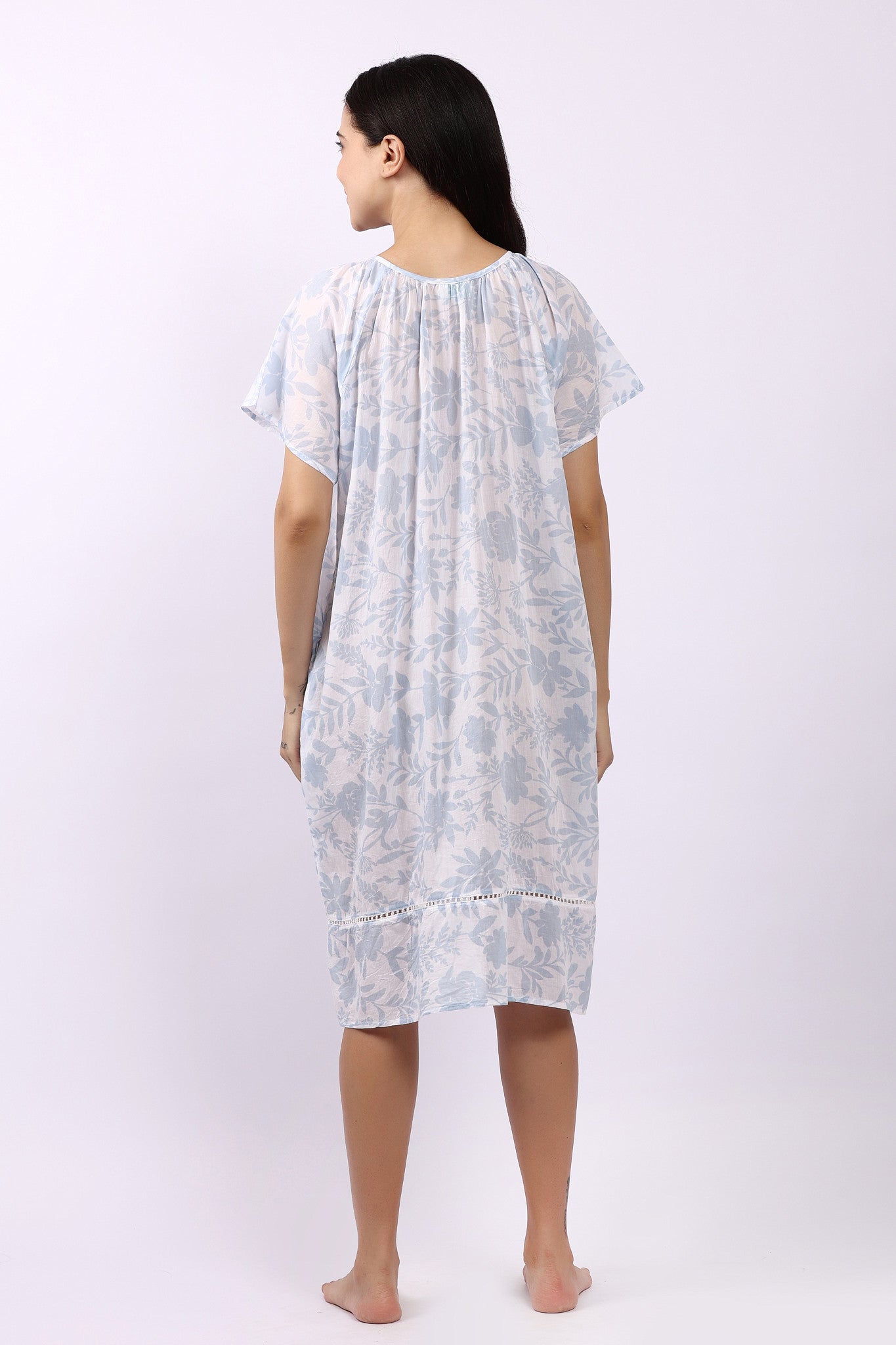 Back of white cotton floral nightdress in sky print with cap sleeves and gathered yoke.