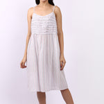 Woman wearing Lotus Frilly Nightie Sky Stripe, sleeveless cotton nightdress with frill detail