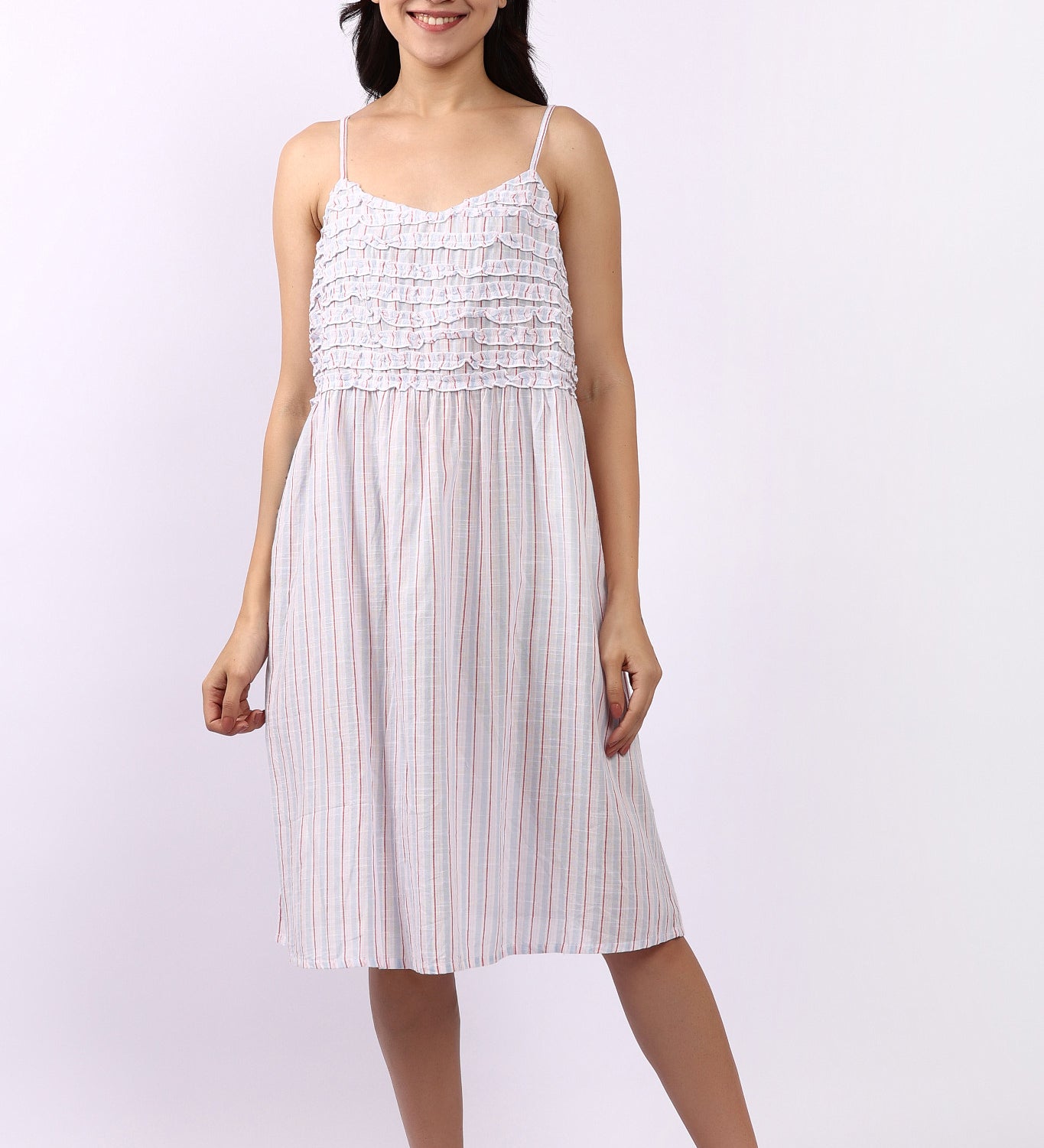 Woman wearing Lotus Frilly Nightie Sky Stripe, sleeveless cotton nightdress with frill detail