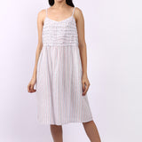 Woman wearing Lotus Frilly Nightie Sky Stripe, sleeveless cotton nightdress with frill detail