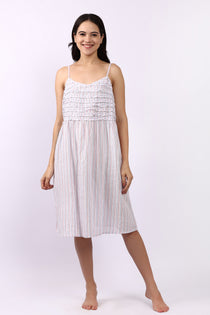 Woman wearing Lotus Frilly Nightie Sky Stripe, sleeveless cotton nightdress with frill detail