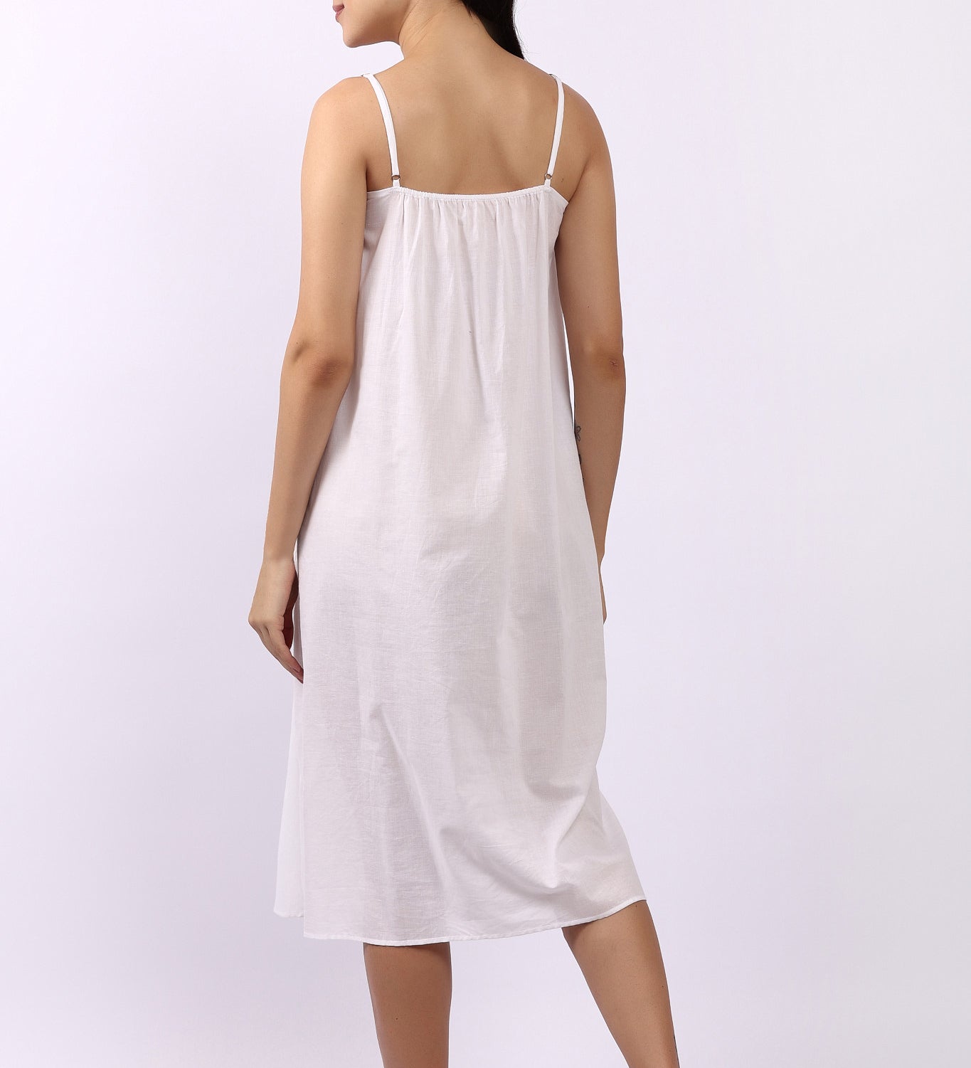 Back of Lotus Susie spaghetti strap white cotton nightie in breathable woven Indian cotton.