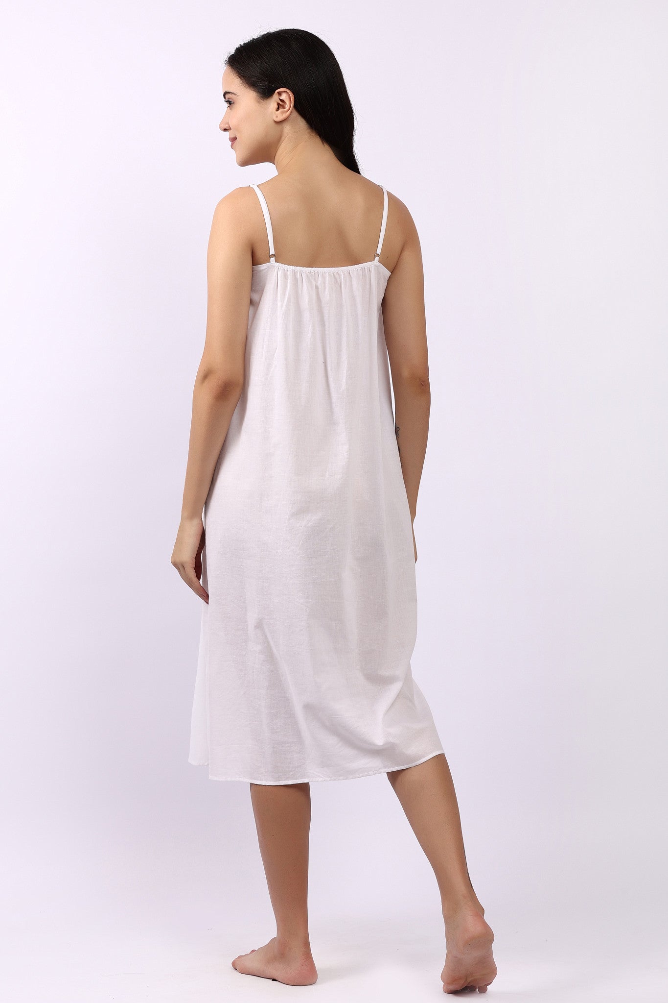 Back of Lotus Susie spaghetti strap white cotton nightie in breathable woven Indian cotton.