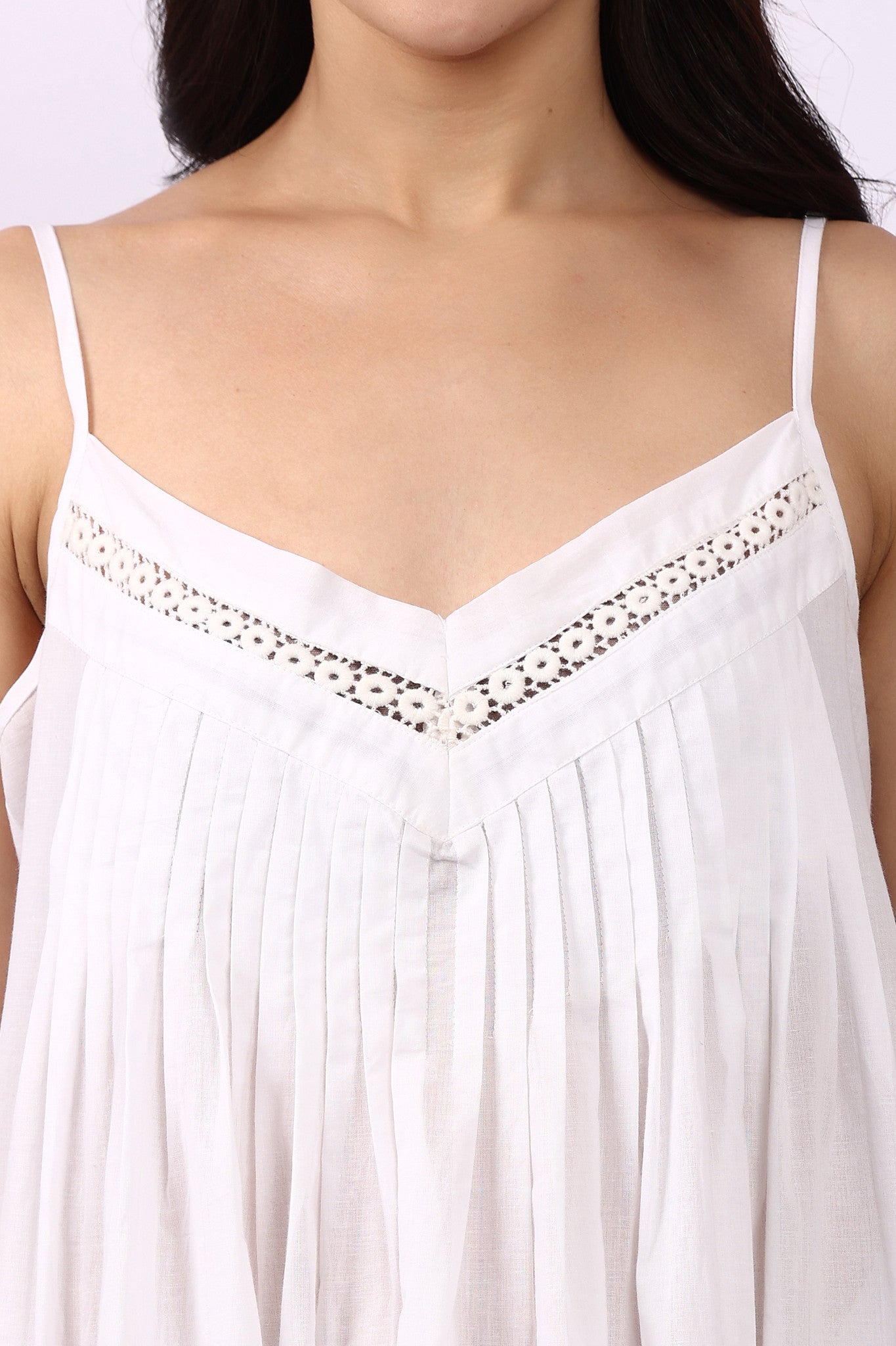 Close-up of lace-trim V-neckline with pintuck detailing on Lotus Susie spaghetti strap cotton nightdress.