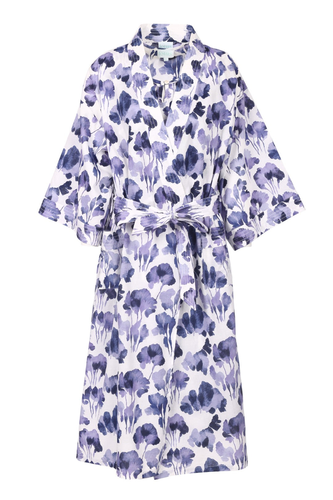 Floral patterned dress with a belt on a white background