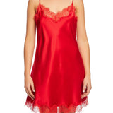 Scarlett Silk Chemise in vibrant red with fine eyelash lace at the neckline and hem, shown on a model for luxurious sleepwear or lingerie styling.