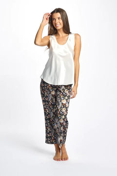 Model wearing ivory Mono Silk Cami paired with printed pants, featuring wide straps and a scoop neckline.