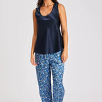 Model wearing navy Mono Silk Cami with printed blue pants, featuring a scoop neckline and wide straps.
