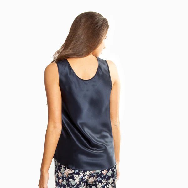 Back view of navy silk cami top showing smooth, elegant drape and relaxed silhouette.