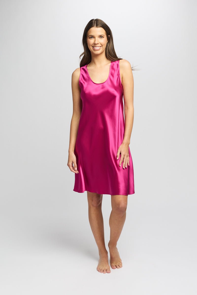Model wearing cerise Mono Silk Short Nightie with wide straps and softly draped 100% silk fabric falling above the knee.