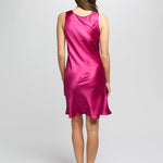 Back view of Model in cerise silk nightie showing a soft A-line silhouette with luxurious sheen and bias-cut shape.