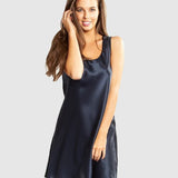 Model wearing Mono Silk Short Nightie in navy, featuring a flattering low neckline, wide straps, and a draped silk finish just above the knee.
