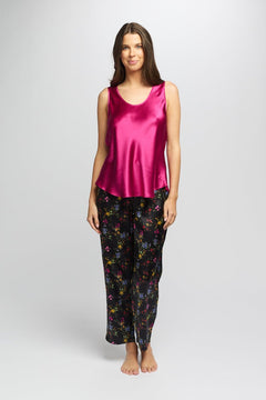 Model wearing bright cerise Mono Silk Cami paired with floral pants, featuring a scoop neckline and wide shoulder straps.