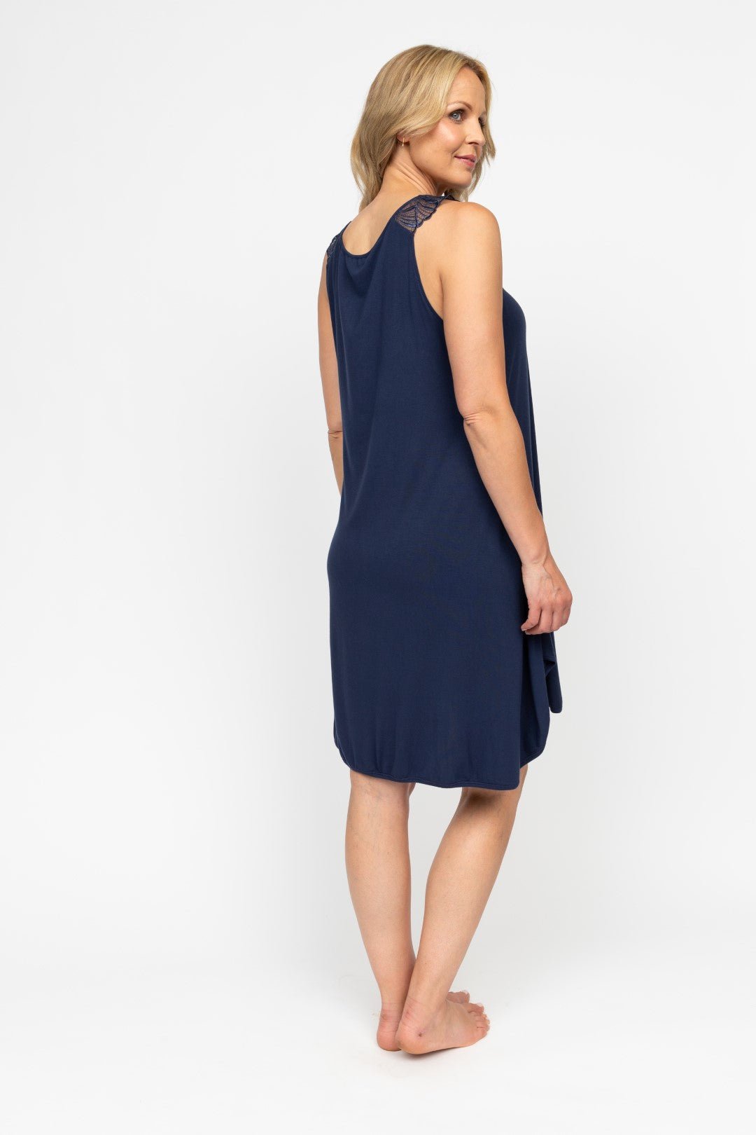 Back view of the Louisa Swing Nightdress, highlighting the relaxed fit, pleating, and shaped hem.