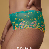 Side angle of Lenca Luxury Thong Sunny Teal from The Foundation, highlighting lace detail and luxurious fit