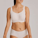 Full-body view of model wearing the Gym Sports Bra in Venus with activewear styling.