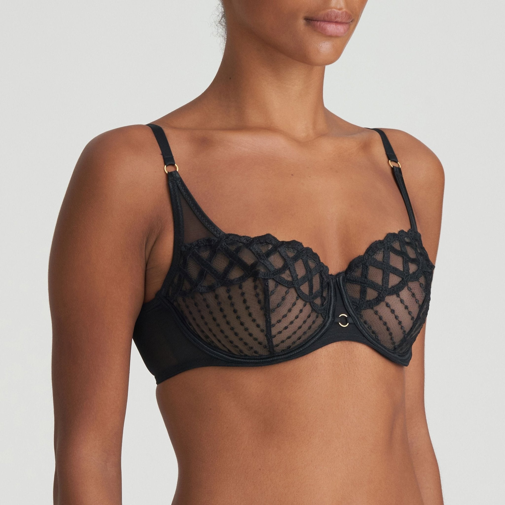 Model wearing Jhana Balcony Bra Black from The Foundation, angled front view highlighting low-cut demi cup and stunning lace design