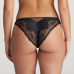 Model wearing Junoo Rio Brief Black from The Foundation, showing full coverage at the back and a confident, stylish fit