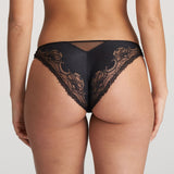 Model wearing Junoo Rio Brief Black from The Foundation, showing full coverage at the back and a confident, stylish fit