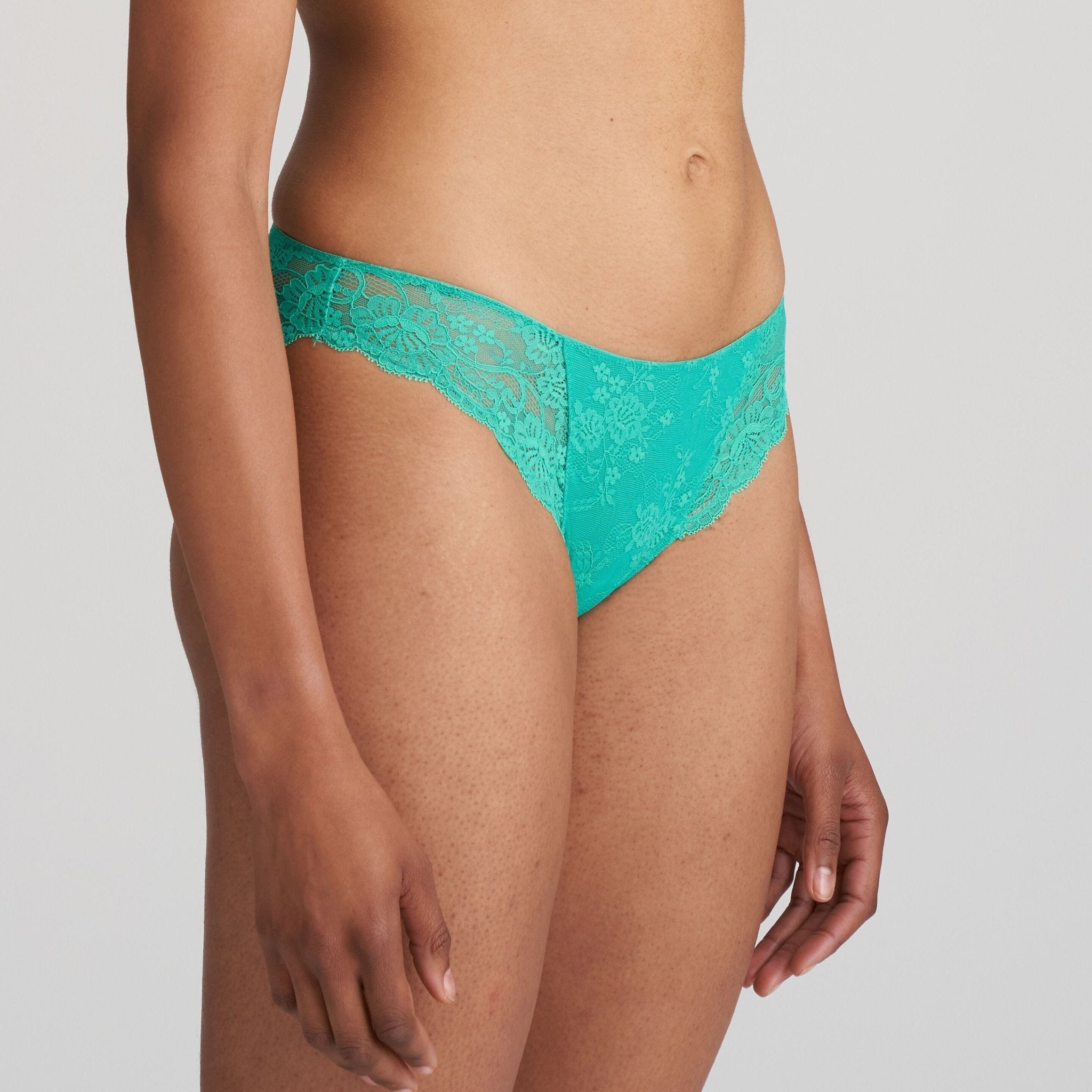 Side angle of the Melipha Rio Brief showcasing smooth lace detailing and curve-enhancing fit.