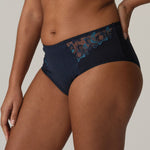 Side view of PrimaDonna Deauville Full Briefs Velvet Blue on model, highlighting smoothing shape and decorative hip embroidery at The Foundation.
