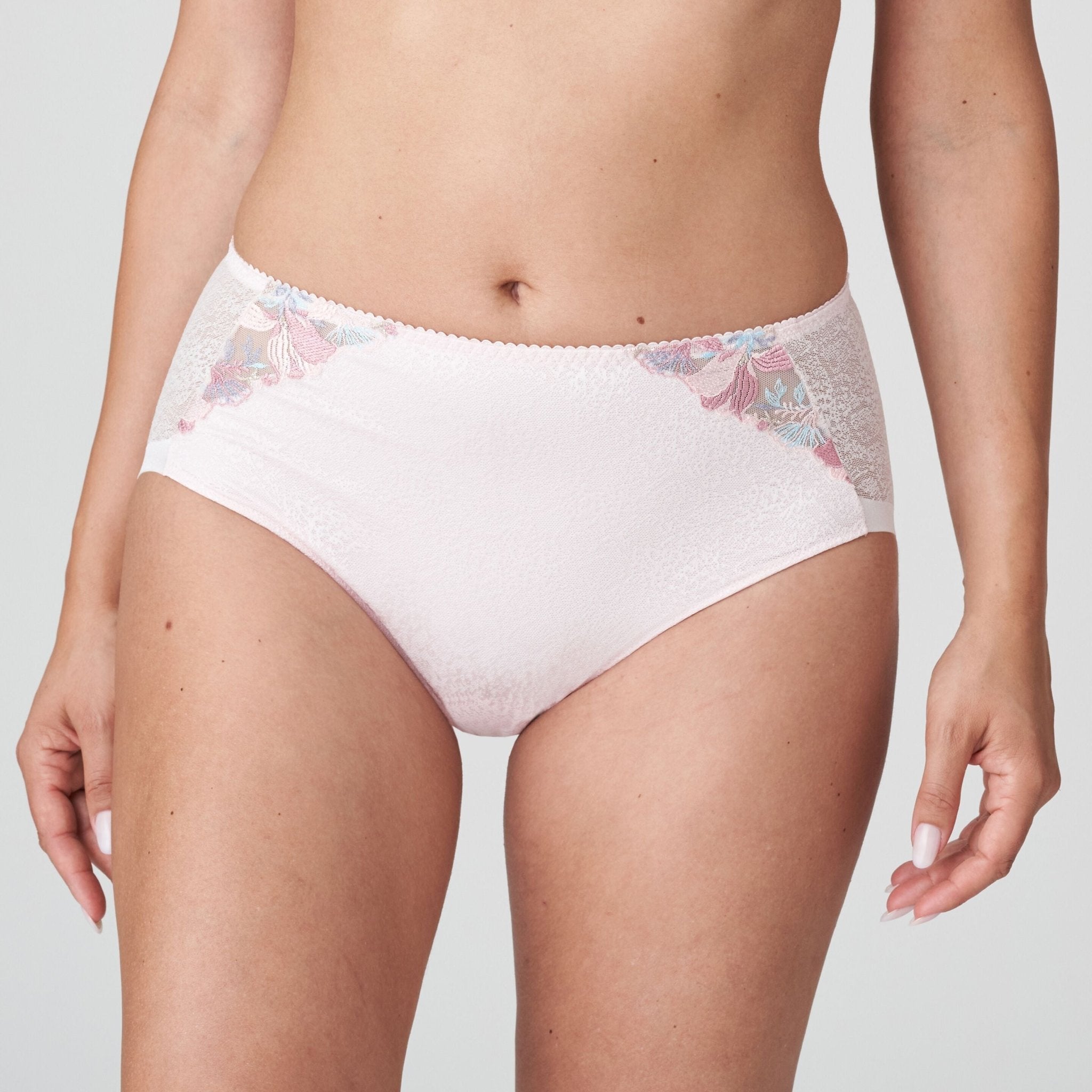Model wearing Mohala Full Briefs pastel pink by The Foundation, featuring high-waist fit and romantic lace embroidery